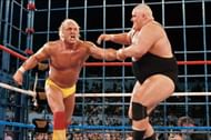 A bloodied King Kong Bundy Irish whips Hulk Hogan in their steel cage match from Wrestlemania II, for the WWE World heavyweight championship